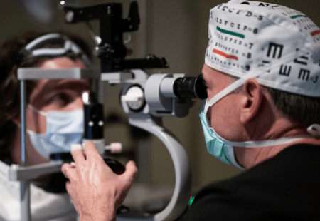 Specialist examines patient to determine if she's a candidate for LASIK eye surgery 