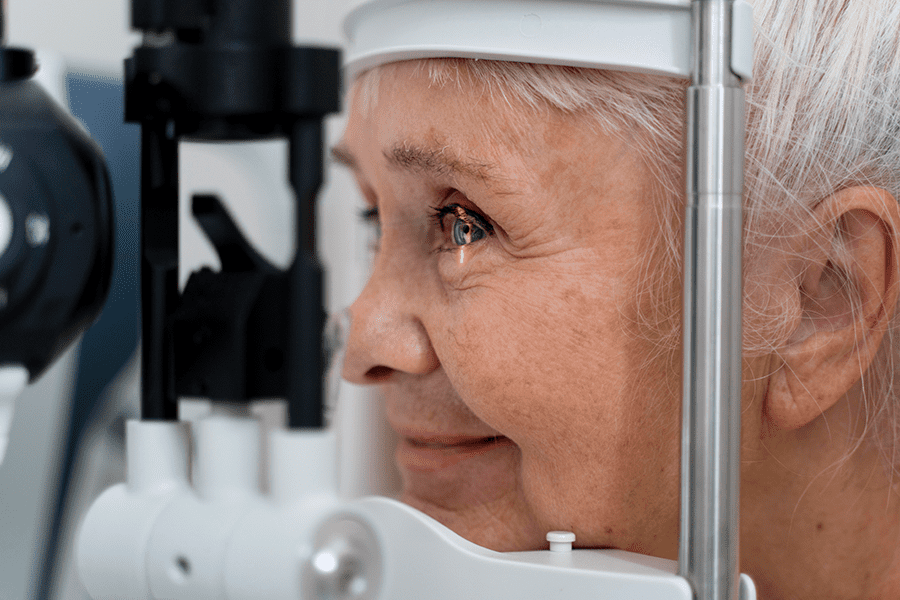 Specialist at Ocala Eye examines a patient's eye for signs of cataract